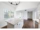 Bright kitchen featuring granite countertops, an island, and dark wood floors at 3451 Keswick Ct, Atlanta, GA 30341