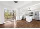 Modern, bright kitchen with stainless steel appliances, white cabinets, and an island with granite countertops at 3451 Keswick Ct, Atlanta, GA 30341