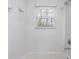 The bathroom has a shower and tub combination and a white tiled showerhead at 3451 Keswick Ct, Atlanta, GA 30341