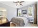 Cozy bedroom with hardwood floors, and abundant natural light at 3999 Treemont Ln, Suwanee, GA 30024