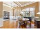 Bright dining area featuring hardwood floors, stylish decor, and easy access to other living spaces at 3999 Treemont Ln, Suwanee, GA 30024