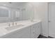 Elegant bathroom with a double vanity, modern fixtures, and a large frameless mirror at 489 Hammons Way, Atlanta, GA 30315