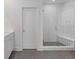 Modern bathroom showcasing a glass-enclosed shower with white subway tile and a built-in bench at 489 Hammons Way, Atlanta, GA 30315