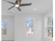 Bright bedroom features a modern ceiling fan and multiple windows offering natural light at 489 Hammons Way, Atlanta, GA 30315