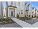 Charming townhome with stone accents, manicured landscaping, and a welcoming front entrance at 489 Hammons Way, Atlanta, GA 30315