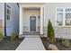 Inviting front entrance with a stylish blue door, stone accents, and a well-maintained walkway at 489 Hammons Way, Atlanta, GA 30315