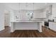 Modern kitchen featuring white cabinets, stainless steel appliances, and a spacious island at 489 Hammons Way, Atlanta, GA 30315