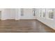 Bright living room boasting hardwood floors, white walls, and many large windows at 489 Hammons Way, Atlanta, GA 30315