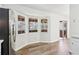 Bright kitchen nook with natural light from bay windows and glass door leading to screened porch at 5537 Riverside Dr, Sugar Hill, GA 30518