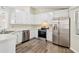 Well-equipped kitchen with stainless steel appliances and ample counter space at 5537 Riverside Dr, Sugar Hill, GA 30518