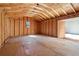 Unfinished shed interior with a small window providing natural light at 5537 Riverside Dr, Sugar Hill, GA 30518