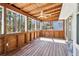 Sunroom with ceiling fan, wood-paneled walls and an amazing view at 5537 Riverside Dr, Sugar Hill, GA 30518