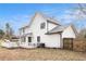 Exterior of the house featuring a deck, a lawn, and a fence at 9556 River Ct, Jonesboro, GA 30238