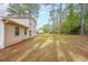 Beautiful backyard featuring mature trees next to the house at 5065 Hubert Dr, Powder Springs, GA 30127