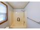 Neutral bathroom with a window, shower and bathtub combo at 5065 Hubert Dr, Powder Springs, GA 30127