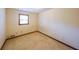 A carpeted bedroom features a window, neutral walls, and baseboard trim at 5065 Hubert Dr, Powder Springs, GA 30127