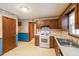 Well-sized kitchen equipped with wood cabinets, a white oven, and ample space at 5065 Hubert Dr, Powder Springs, GA 30127