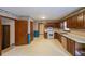 This expansive kitchen features wood cabinets, white appliances, and generous counter space at 5065 Hubert Dr, Powder Springs, GA 30127