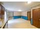 The kitchen area featuring wood cabinets, white counters, and open space at 5065 Hubert Dr, Powder Springs, GA 30127