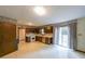 Spacious kitchen with wood cabinetry, an oven, and sliding glass doors leading to the outside at 5065 Hubert Dr, Powder Springs, GA 30127