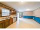 View of the kitchen featuring wood cabinets, a white oven, and a sliding glass door at 5065 Hubert Dr, Powder Springs, GA 30127