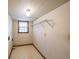 Functional laundry room with shelving, linoleum floors, and a window for natural light at 5065 Hubert Dr, Powder Springs, GA 30127