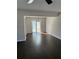 Dining room featuring wood flooring, a ceiling fan, and sliding glass doors at 5891 Raven Ln, Lithonia, GA 30058