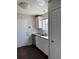 Cozy kitchen featuring bright white cabinets, granite counters, and stainless steel appliances at 5891 Raven Ln, Lithonia, GA 30058