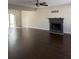 Spacious living room features hardwood floors and a cozy fireplace at 5891 Raven Ln, Lithonia, GA 30058