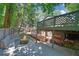 Outdoor deck with stone fire pit and built-in seating, perfect for entertaining guests and Gathering at 7360 Fields Dr, Cumming, GA 30041