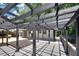 Expansive outdoor deck featuring an overhead pergola and outdoor living and entertainment space at 7360 Fields Dr, Cumming, GA 30041