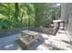 Wooden deck area with a picnic table, perfect for outdoor enjoyment and relaxation at 7360 Fields Dr, Cumming, GA 30041