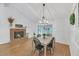 Open living and dining area with fireplace and decor at 7360 Fields Dr, Cumming, GA 30041
