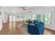 Spacious living room features wood floors, lots of windows, and vaulted ceiling at 7360 Fields Dr, Cumming, GA 30041