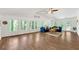 Spacious living room features wood floors, lots of windows, and vaulted ceiling at 7360 Fields Dr, Cumming, GA 30041
