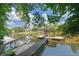 Scenic waterfront view featuring a private dock and serene surroundings at 7360 Fields Dr, Cumming, GA 30041