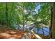 Scenic waterfront view featuring a private dock and serene surroundings at 7360 Fields Dr, Cumming, GA 30041