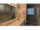 Bathroom with tile flooring, a window, and a vanity with a large mirror at 1343 Willow Sw Trl, Atlanta, GA 30311