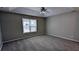 Large bedroom featuring neutral walls, a ceiling fan, and ample natural light at 1343 Willow Sw Trl, Atlanta, GA 30311