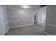 Bright dining area with tile flooring, neutral walls, and modern lighting fixtures at 1343 Willow Sw Trl, Atlanta, GA 30311