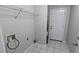 This tiled laundry room has hookups, and space for essential appliances and storage at 1343 Willow Sw Trl, Atlanta, GA 30311