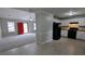 Open floor plan connecting the living room and kitchen with tile and carpet flooring at 1343 Willow Sw Trl, Atlanta, GA 30311