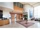 Welcoming lobby with travertine floors, wood paneled walls, contemporary chandelier and plush seating area at 2881 Peachtree Ne Rd # 1001, Atlanta, GA 30305