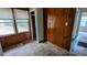 Bedroom featuring wood paneled wall and several windows for natural light at 2914 Wanda Sw Cir, Atlanta, GA 30315