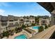 Aerial view showcases the community's pools, townhomes, and landscaped grounds for relaxed upscale living at 6657 Encore Blvd, Atlanta, GA 30328