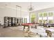 Bright clubhouse featuring a billiards table, dining space, lounge seating and large windows with natural light at 6657 Encore Blvd, Atlanta, GA 30328