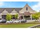 Commercial retail building featuring restaurants and other shops with street parking and lush landscaping at 6657 Encore Blvd, Atlanta, GA 30328