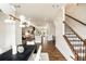 Open layout, where the dining area flows seamlessly into the kitchen and stairs, creating a sense of space and connection at 6657 Encore Blvd, Atlanta, GA 30328