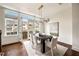 Elegant dining space with hardwood floors, large windows, and chic lighting is great for entertaining and dining experiences at 6657 Encore Blvd, Atlanta, GA 30328