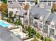 Upscale home exteriors with a shared pool area, private patios, and lush greenery at 6657 Encore Blvd, Atlanta, GA 30328
